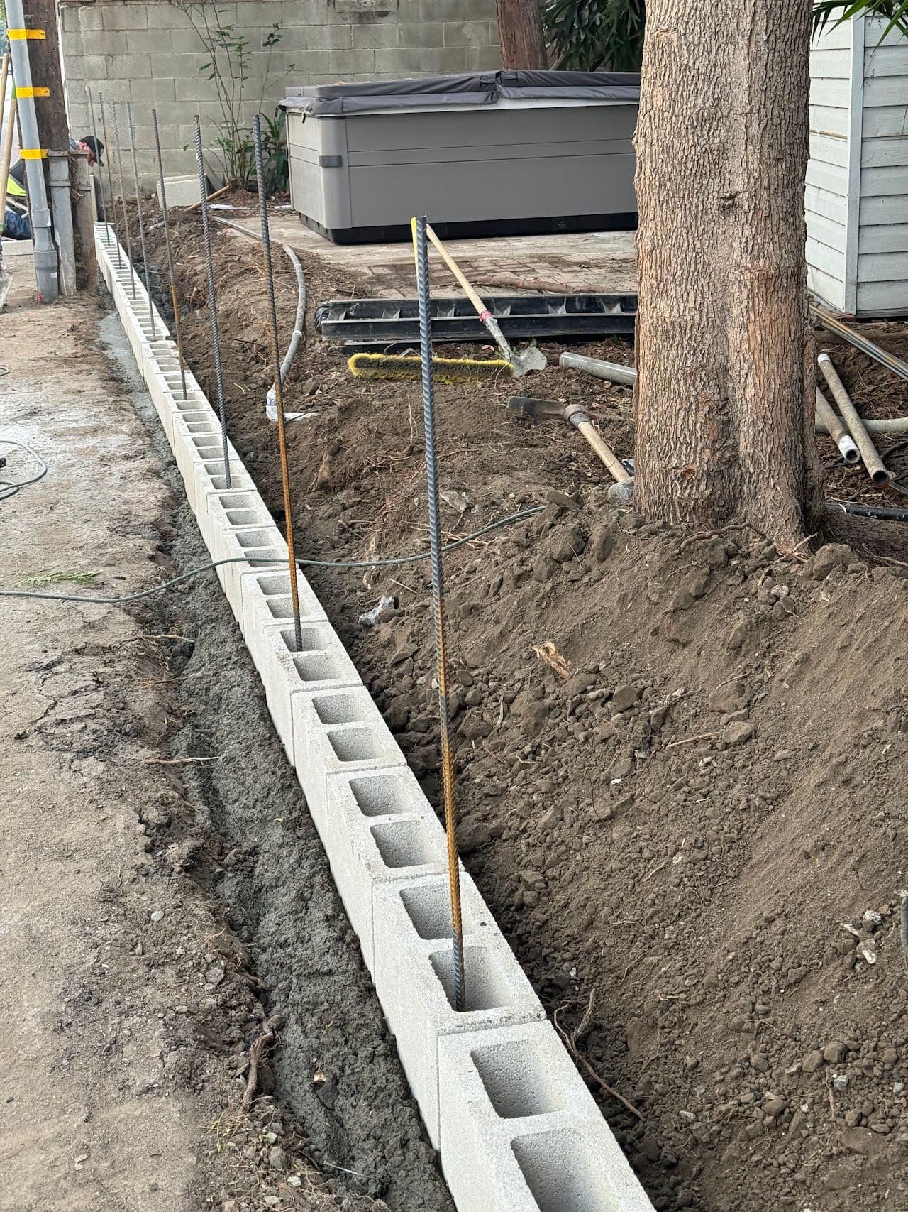 Rebar standing in the cells of a new block wall