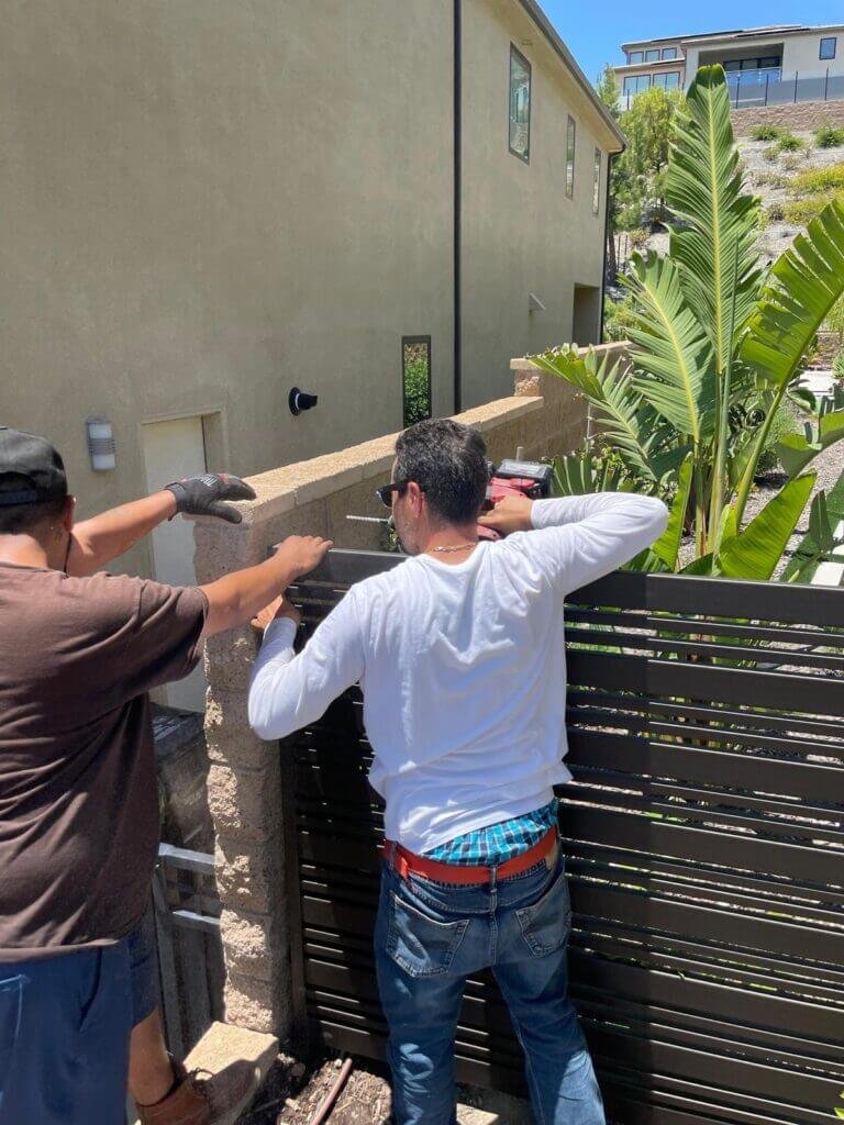 Working on gate fence installation