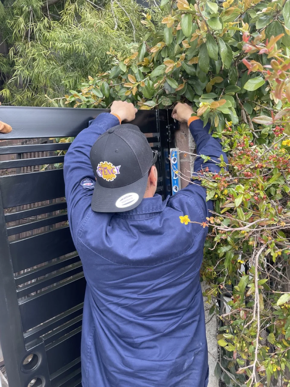 Working on metal fence installation
